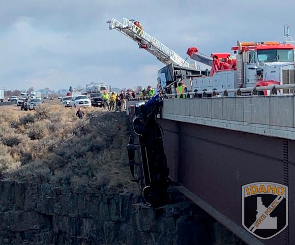 Truck rescue hangs off bridge