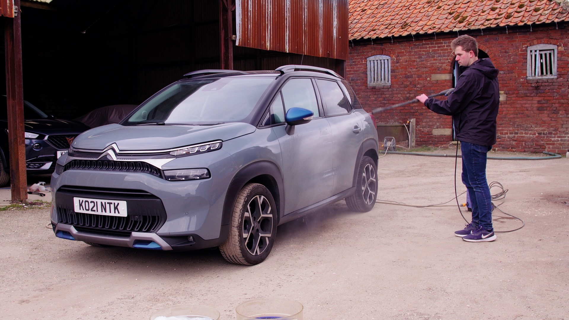 Jet washing a car