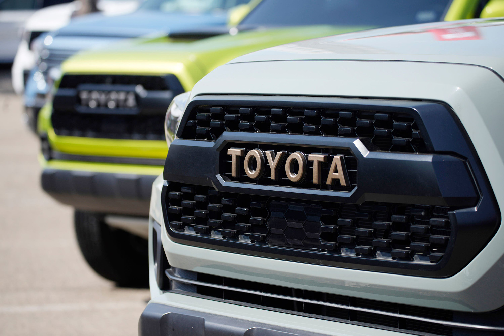 Toyota logo highlights the grille of a 2021 Tacoma pickup, via PA